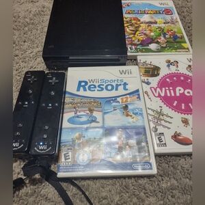 Nintendo Wii color black with two motion plus controllers and 3 Games